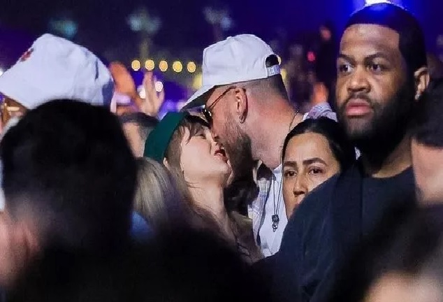 Travis Kelce can't get his hands off Taylor Swift