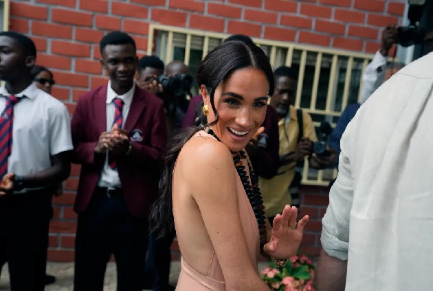 ponytail to show off her vintage gold Lanvin